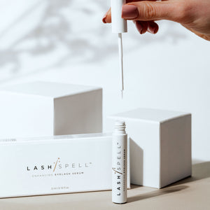 LashSpell lash enhancing serum packaging with the main component sitting next to white box.